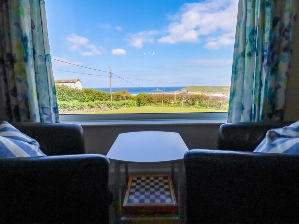 A living room with a view of the ocean at Pentreath in Crantock