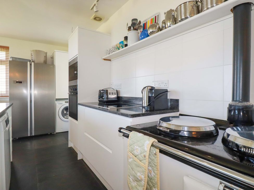 A kitchen featuring appliances and a countertop at Pentreath in Crantock