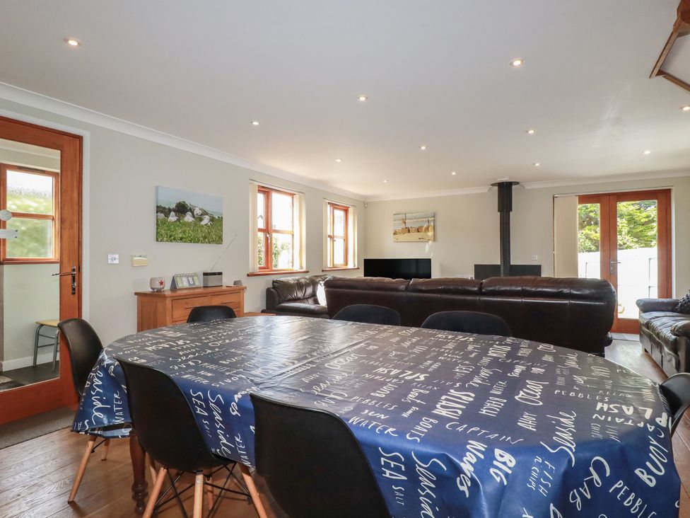 A dining room with a table and chairs at Carpe Diem in Crantock