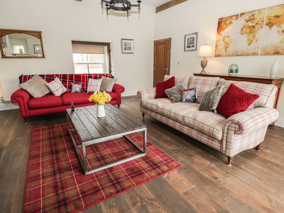 A living room with two sofas and a coffee table at The Turnip Barn in 