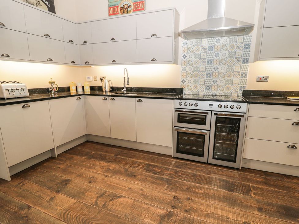 A kitchen with cabinets and appliances at The Turnip Barn