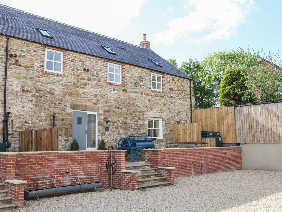 An outdoor area with a stone house and steps at The Turnip Barn in 