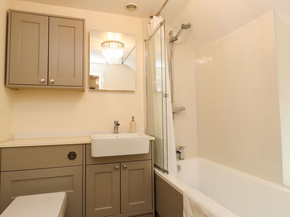 A bathroom with a sink and bathtub at Tan Y Goeden in Morfa Nefyn