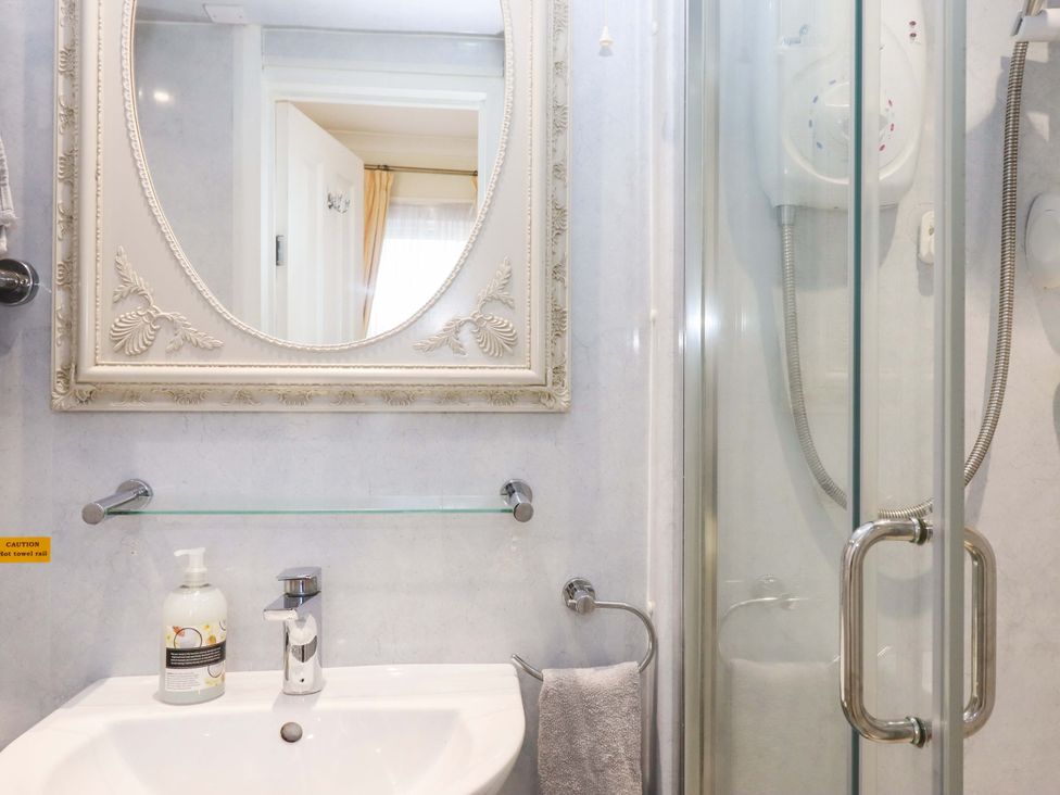 A bathroom with a sink and shower at Avenue Park Villa Torquay