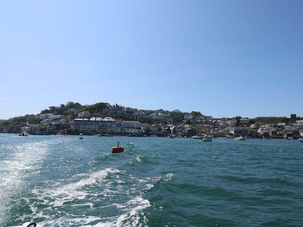 A view of boats and buildings on a shore at Avenue Park Villa in Torquay