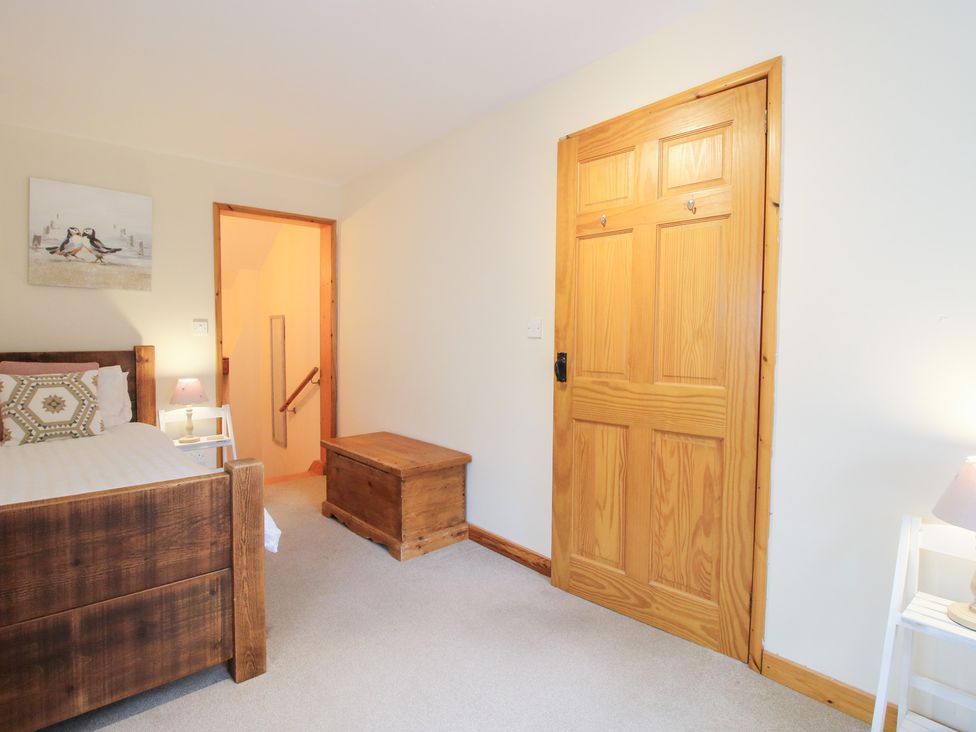 A bedroom with bed and chest at Old Hall Barn 1 Church Stretton