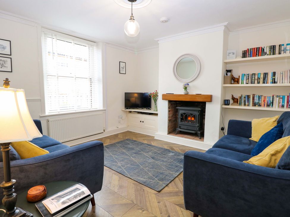 A living room with a sofa and television at Springfield in Hempton near Fakenham