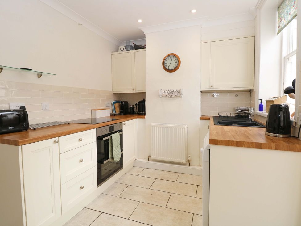 A kitchen with appliances and wooden countertops at Springfield in Hempton near Fakenham