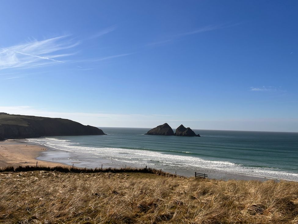 A view of beach and ocean with rocks at Holywell Bay View in Holywell Bay