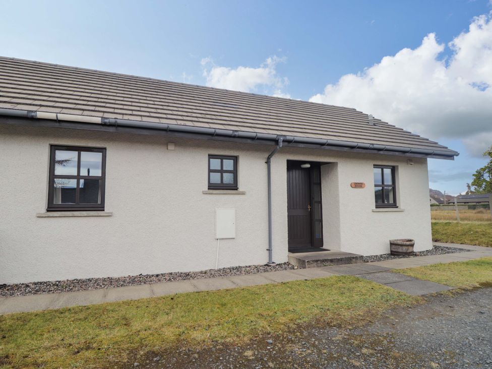 A house with a door and windows at Church House in Poolewe