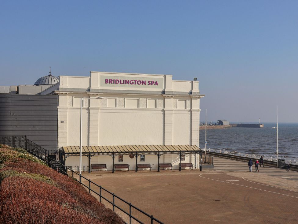 A building with a sign on the shore at Bridlington Spa in Bridlington