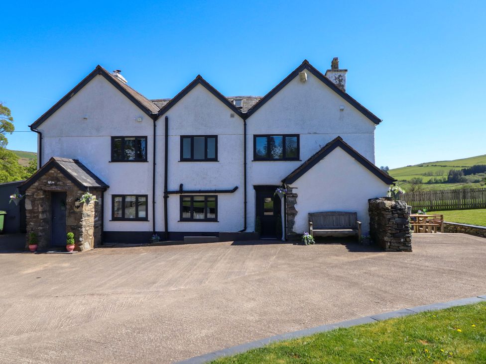 A house with a driveway and lawn at Cefn Nannau near Ty-nant Cerrigydrudion