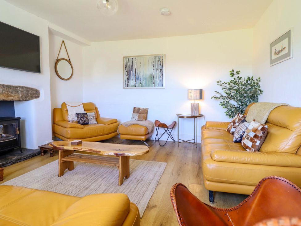 A living room with sofas and a coffee table at Cefn Nannau Ty-nant near Cerrigydrudion