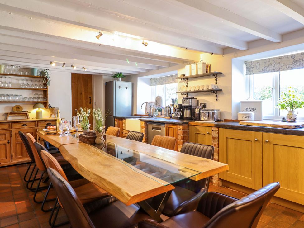A kitchen with a dining table and chairs at Cefn Nannau near Ty-nant Cerrigydrudion