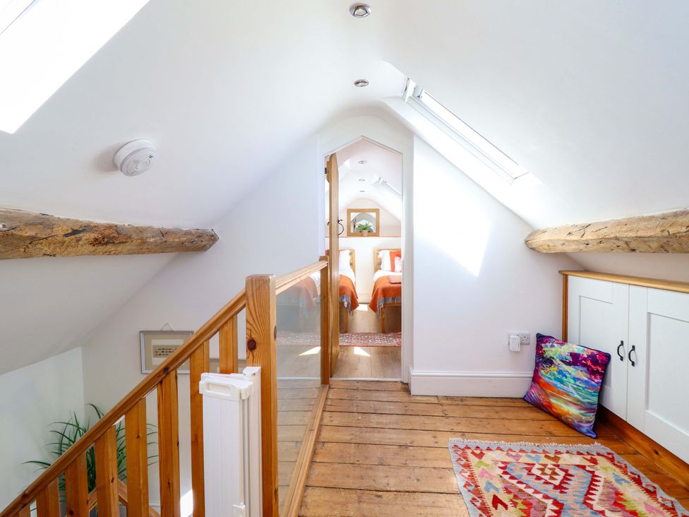 A hallway with a staircase leading to a bedroom at Cefn Nannau near Ty-nant Cerrigydrudion
