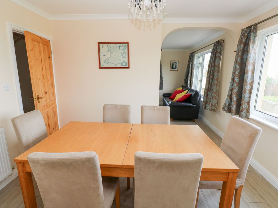 A dining room with a table and chairs at Cherry Trees in Haverfordwest