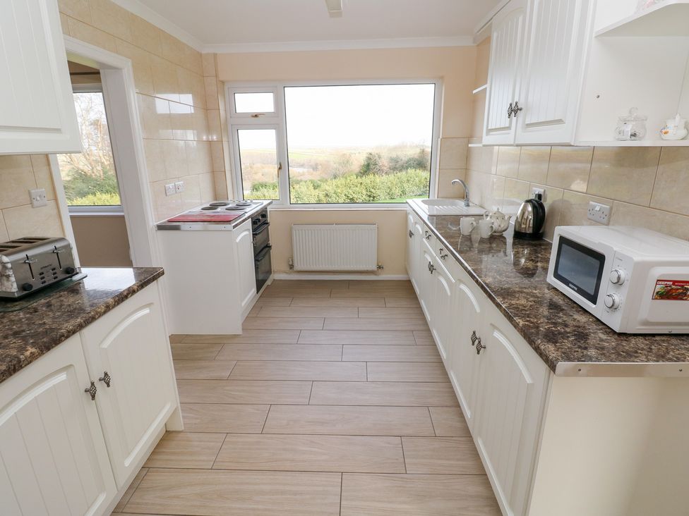 A kitchen with various appliances at Cherry Trees Haverfordwest
