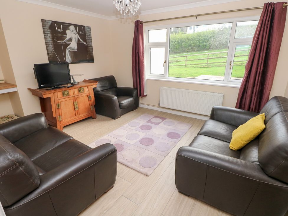 A living room with furniture and a window at Cherry Trees in Haverfordwest
