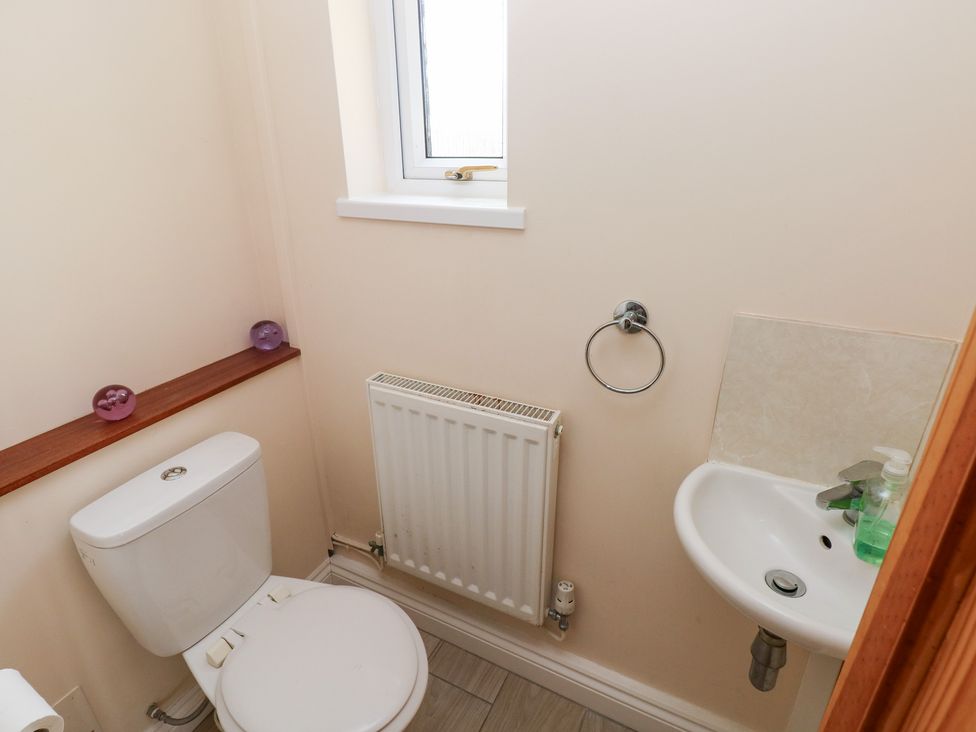 A bathroom with a sink and toilet at Cherry Trees in Haverfordwest