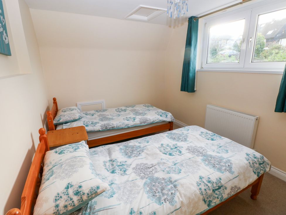 A bedroom with two single beds at Cherry Trees in Haverfordwest