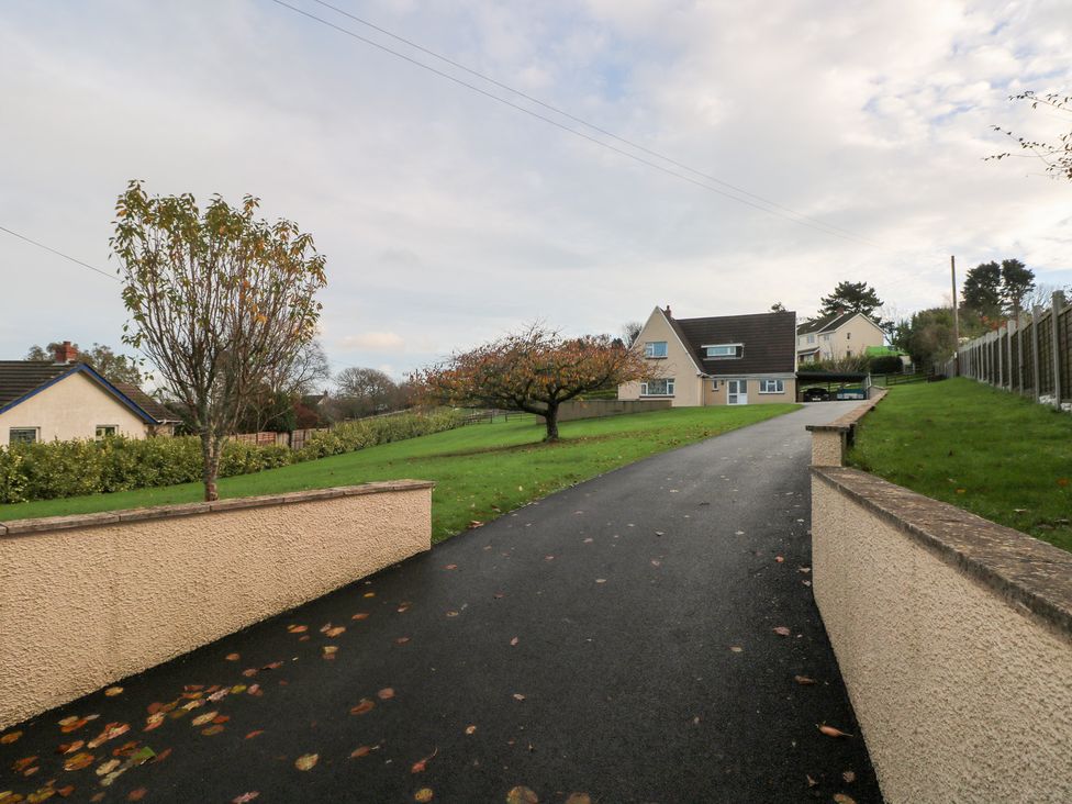 A house with trees and a driveway at Cherry Trees in Haverfordwest
