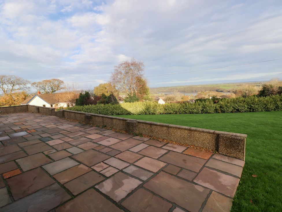 A patio with a view of the landscape at Cherry Trees in Haverfordwest