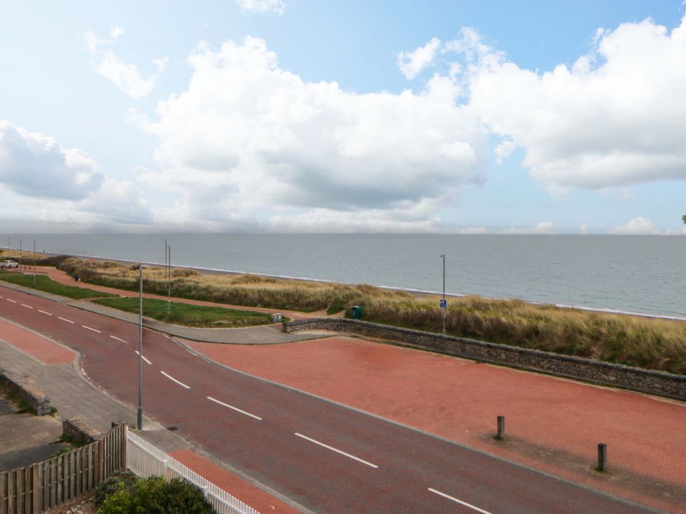 A view of the sea and sky from a road near the beach at Welymora Pwllheli