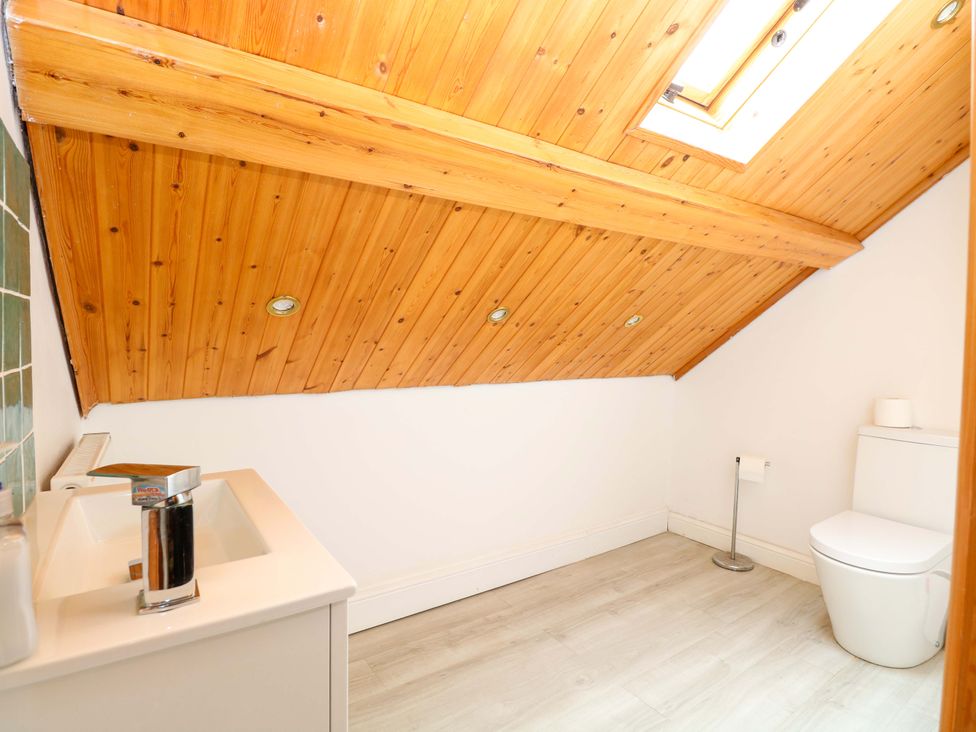 A bathroom with a sink and toilet at Tilly's Retreat in Hunstanton