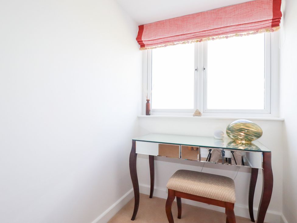 An office with a desk and chair at Seaspell Beach House in Constantine Bay