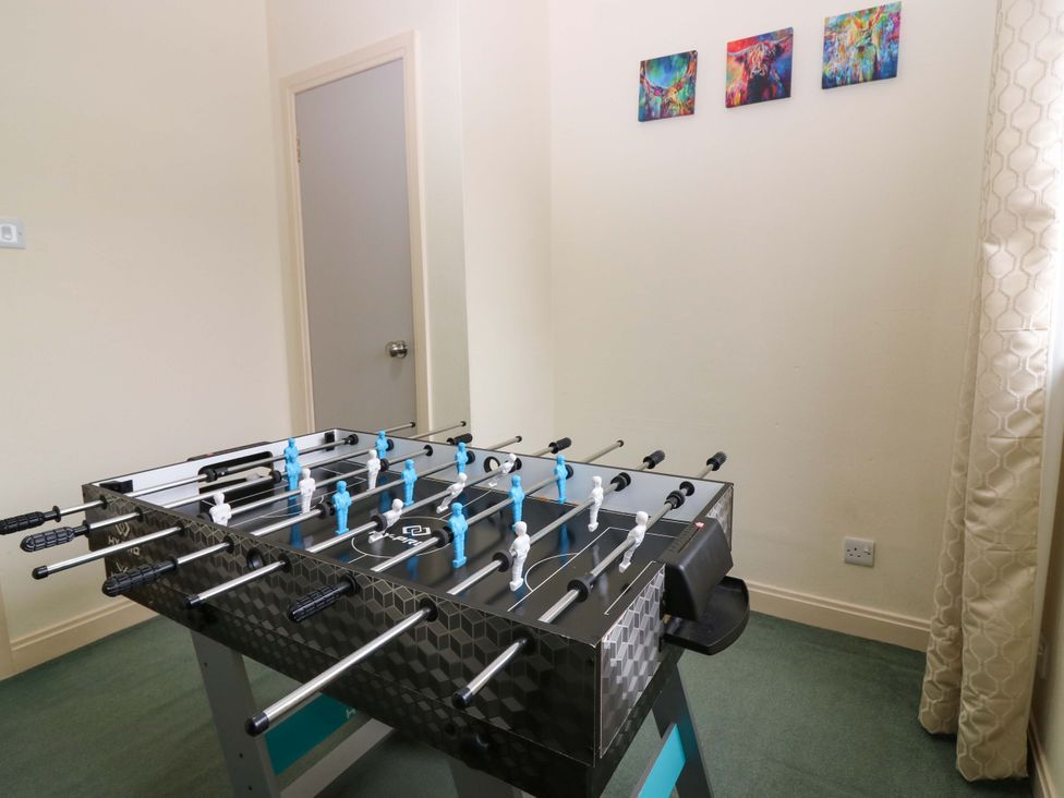 A foosball table in a game room at Falla Farmhouse in Jedburgh