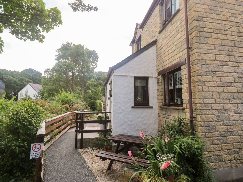 A house with a garden and pathway at Tranquility in Falmouth