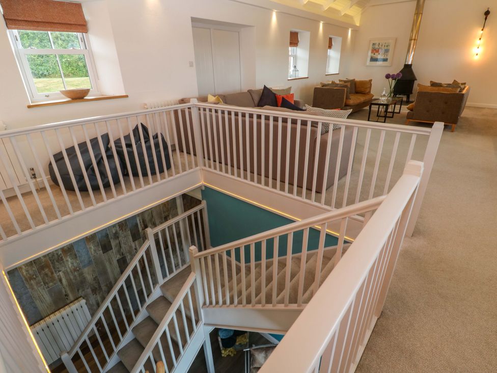 A staircase and seating area at Silvermine House in Charlestown