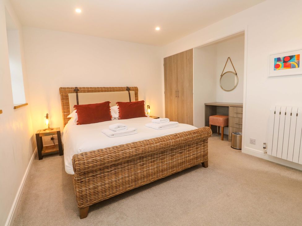 A bedroom with a bed and bedside table at Silvermine House in Charlestown