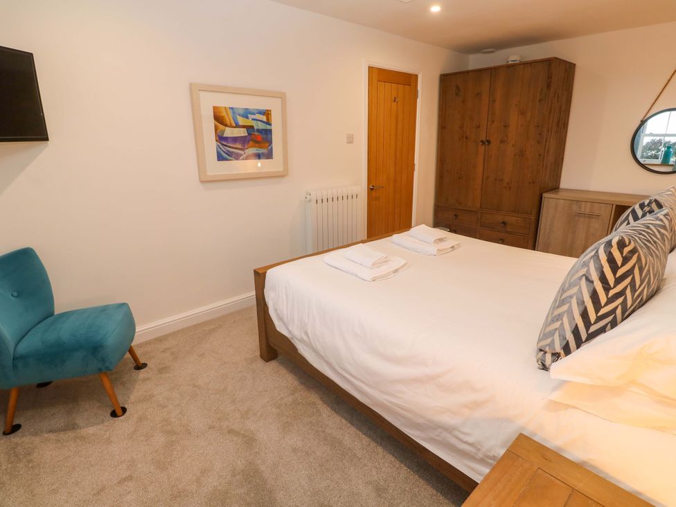 A bedroom with a bed and furniture at Silvermine House in Charlestown