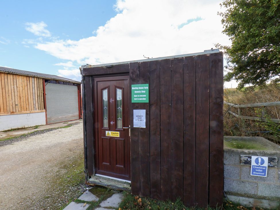 A door with signs at the honesty shop at Stable Cottage in Staintondale