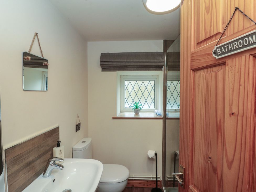 A bathroom with a sink and toilet at Foxhunter Cottage in Hawsker near Whitby and Robin Hood's Bay