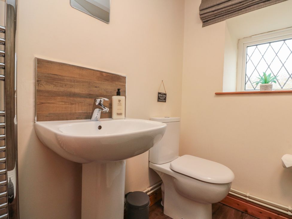 A bathroom with a sink and toilet at Foxhunter Cottage in Hawsker near Whitby and Robin Hood's Bay