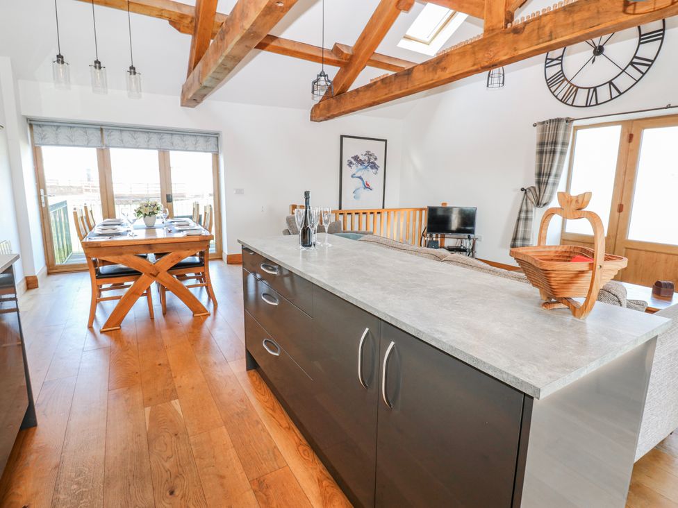 A dining room with a table and chairs at Apple Tree Cottage near Kirkby Stephen