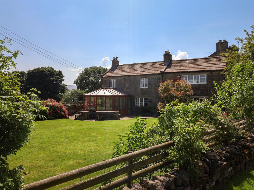 A house with a conservatory and garden at Lyndhurst, Carlton-in-Coverdale, near Leyburn