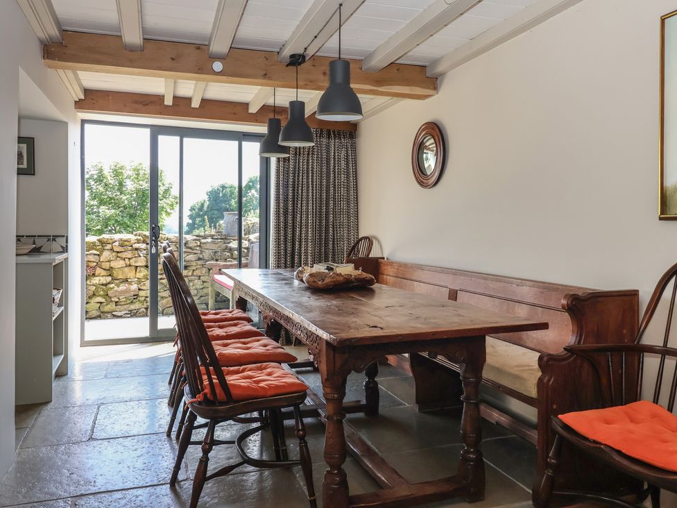 A dining room with a wooden table and chairs at Lyndhurst in Carlton-in-Coverdale near Leyburn