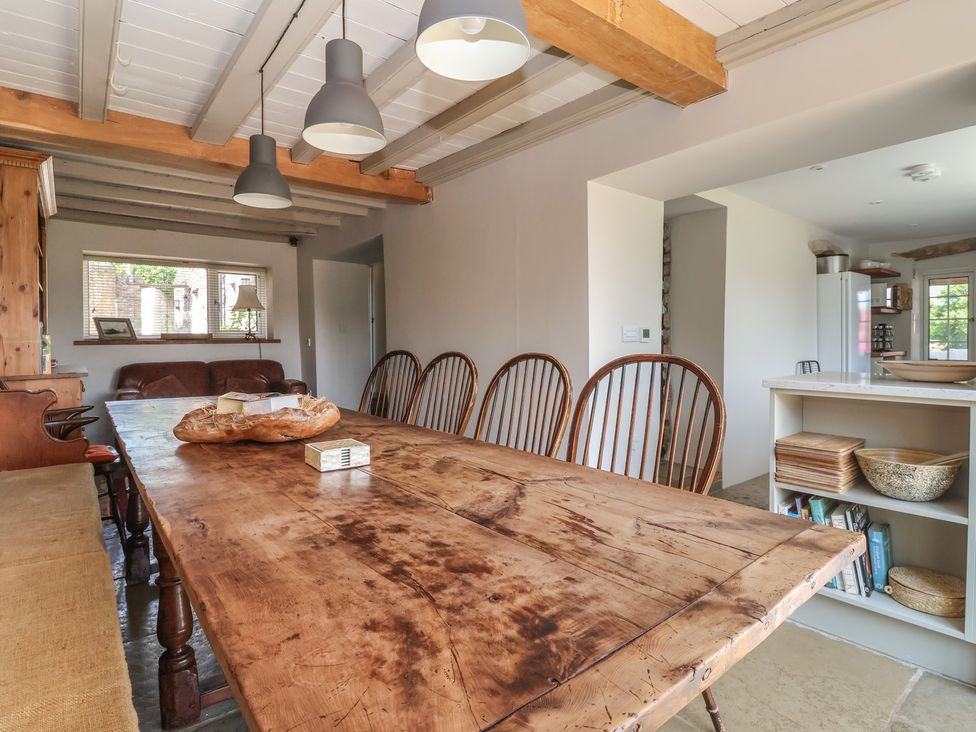 A dining room with a wooden table and chairs at Lyndhurst, Carlton-in-Coverdale, near Leyburn