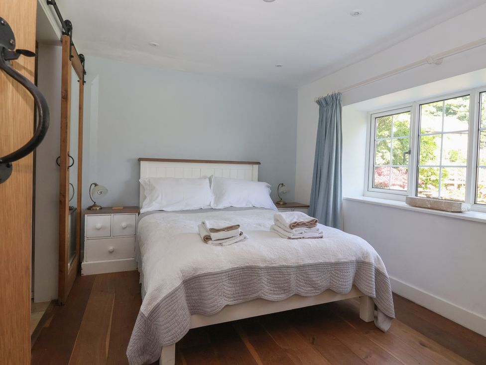 A bedroom with a bed and wardrobe at Lyndhurst in Carlton-in-Coverdale, near Leyburn