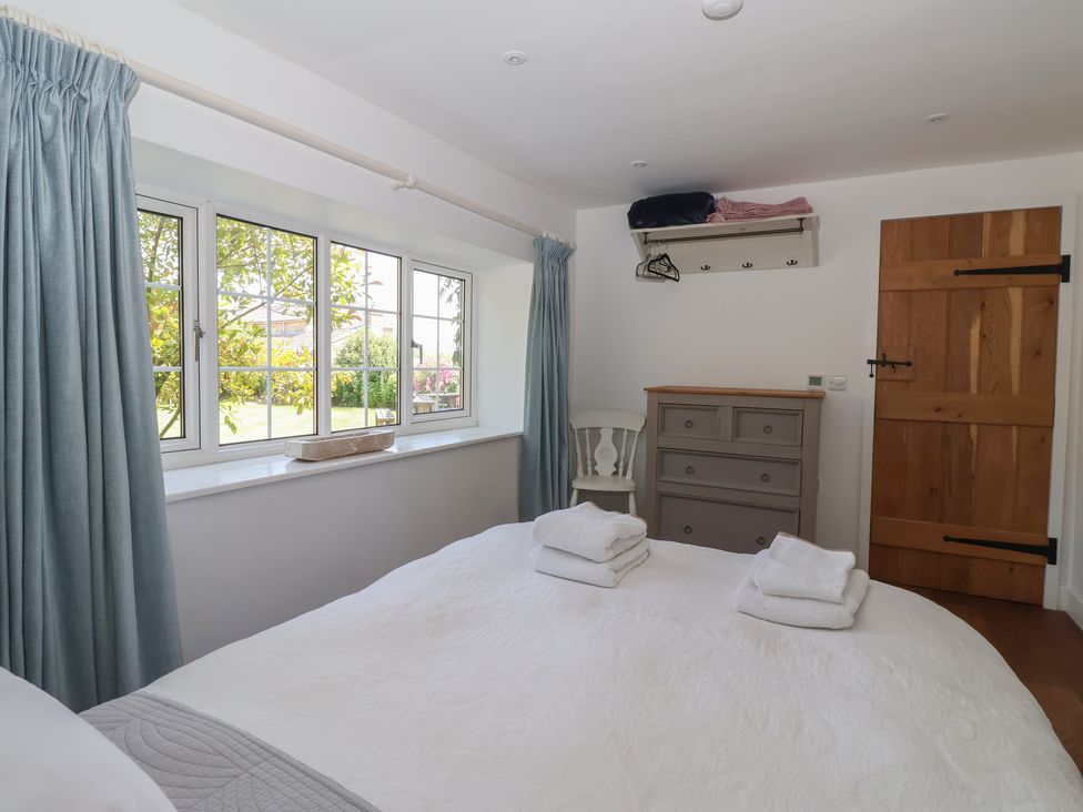 A bedroom with a bed and a dresser at Lyndhurst in Carlton-in-Coverdale, near Leyburn