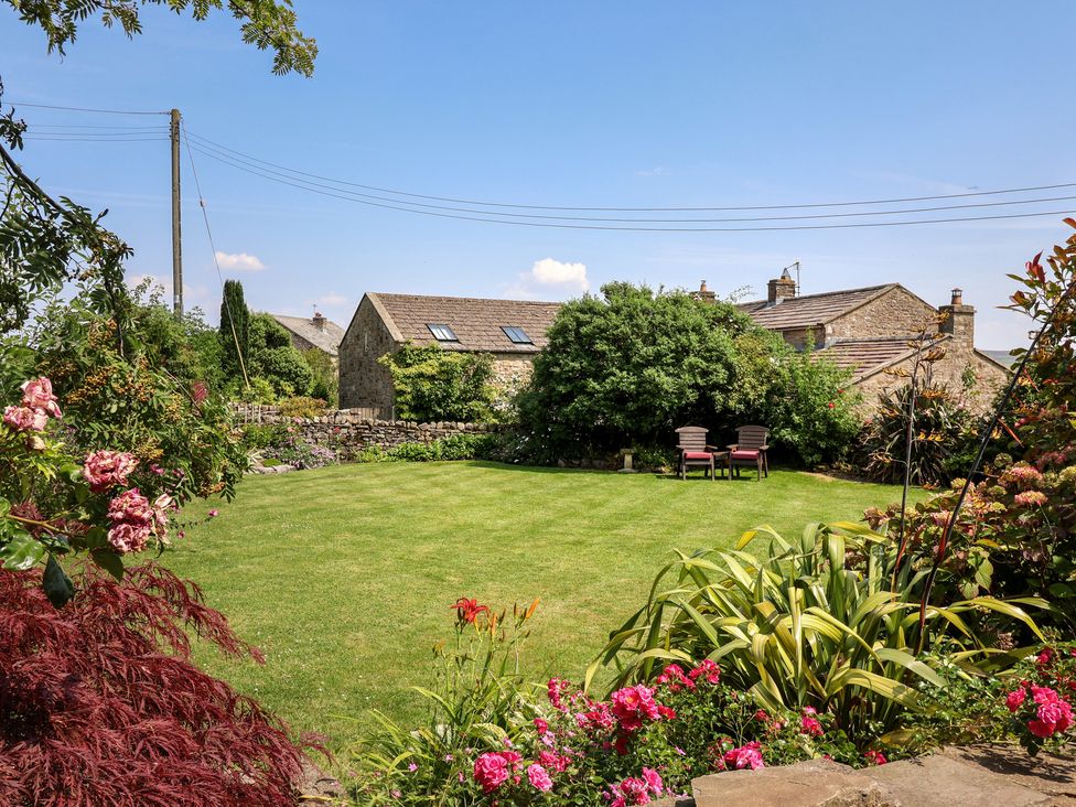 A garden with flowers and chairs at Lyndhurst, Carlton-in-Coverdale, near Leyburn