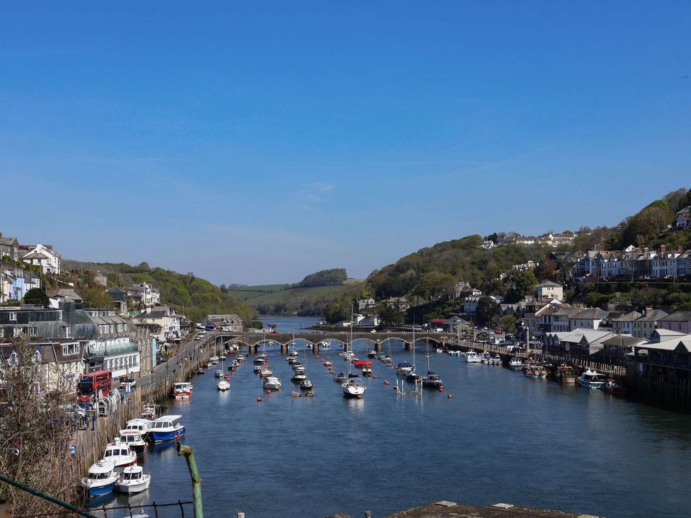 A view of boats in the water near a bridge at Lily Cottage in Looe