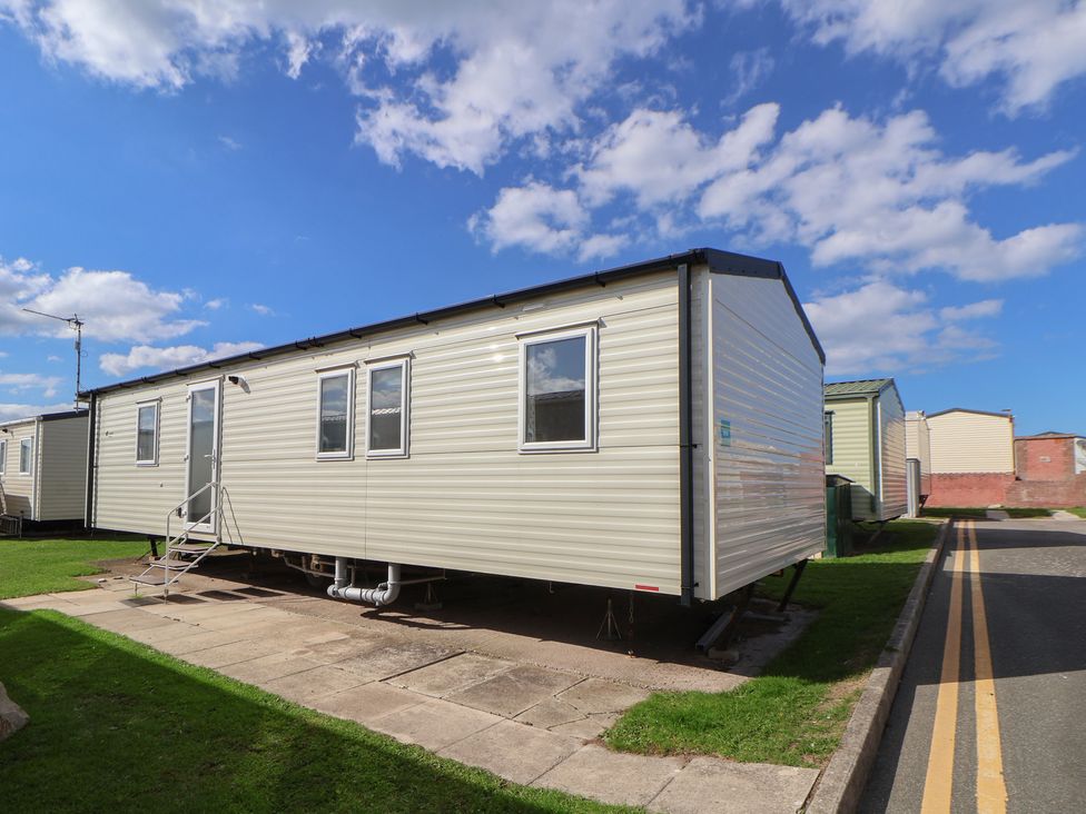 A static caravan with steps and windows at K2 Static Caravan