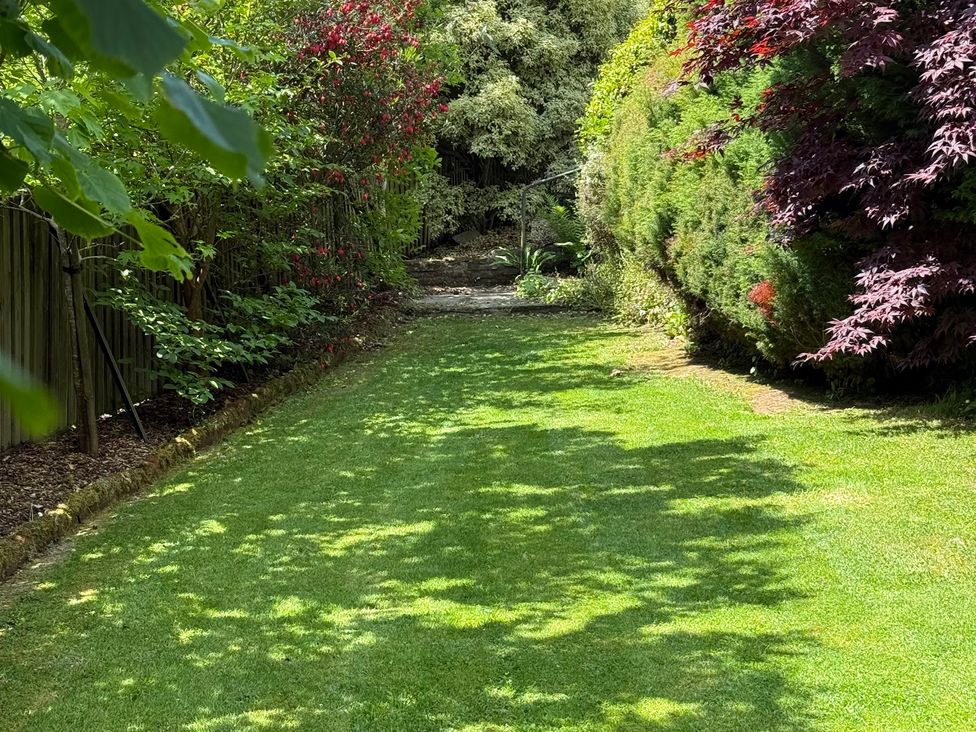 A garden pathway surrounded by bushes at Penlaurel in Launceston
