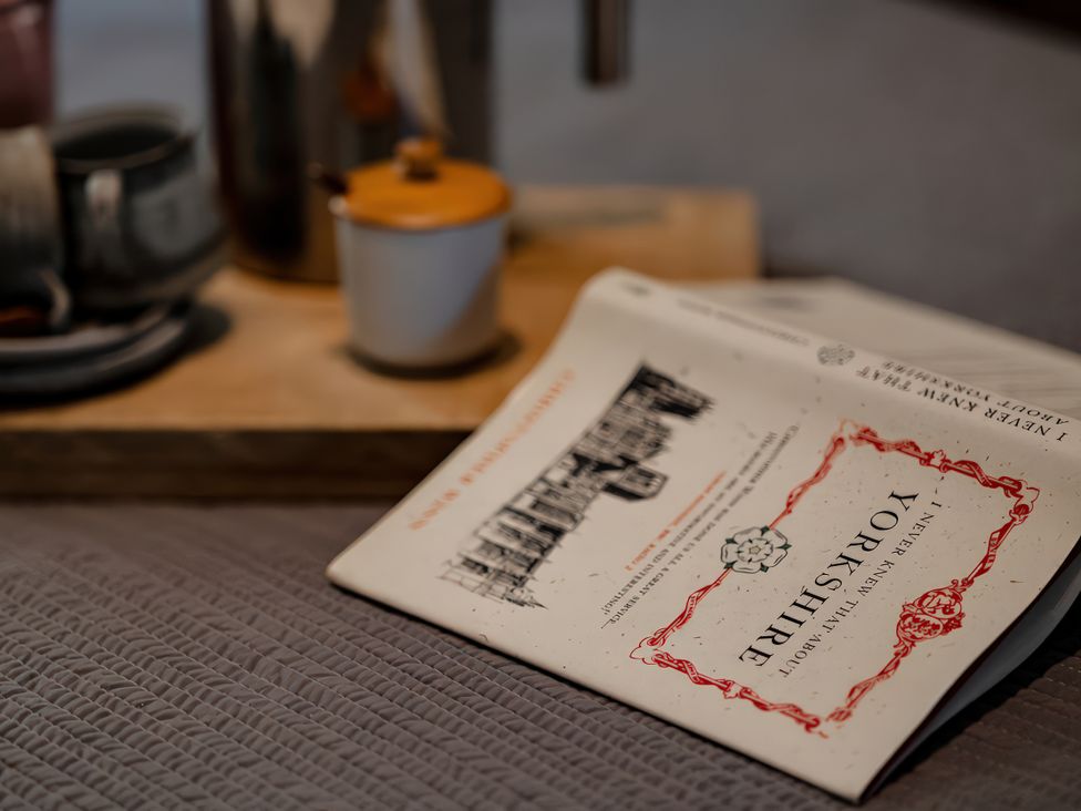 A book and tea set on a tray at Carrholme Cottage in Settle