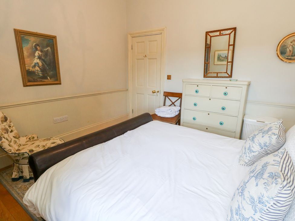 A bedroom with a bed and furniture at Maple Cottage Buckland Newton near Dorchester