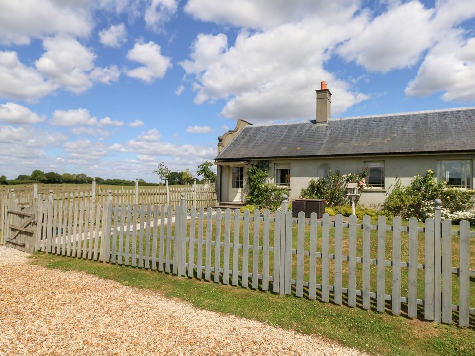 A cottage with a fence and garden at Maple Cottage Buckland Newton near Dorchester
